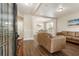 Spacious living room with hardwood floors, fresh paint, and bright, natural light at 424 Citronelle Dr, Woodstock, GA 30188