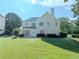 Expansive backyard with lush lawn and mature trees create a private retreat at 10770 Glenhurst Pass, Duluth, GA 30097