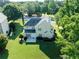 A lush green backyard with mature landscaping and two story home at 10770 Glenhurst Pass, Duluth, GA 30097