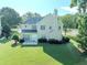 Expansive backyard with lush lawn and mature trees create a private retreat at 10770 Glenhurst Pass, Duluth, GA 30097