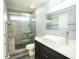 Bathroom features glass enclosed shower, updated vanity, and modern fixtures at 10770 Glenhurst Pass, Duluth, GA 30097