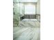Bathroom featuring marble floors, mosaic tile accents, glass shower, and soaking tub at 10770 Glenhurst Pass, Duluth, GA 30097