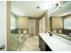 Beautiful bathroom featuring marble floors, double vanity, glass shower, and soaking tub at 10770 Glenhurst Pass, Duluth, GA 30097