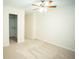Bedroom with a ceiling fan and an attached closet at 10770 Glenhurst Pass, Duluth, GA 30097