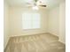Cozy bedroom features a window for natural light and neutral carpet at 10770 Glenhurst Pass, Duluth, GA 30097