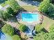 An aerial view of a community pool surrounded by trees at 10770 Glenhurst Pass, Duluth, GA 30097