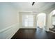Elegant dining room with dark wood floors, wainscoting, and stylish light fixture at 10770 Glenhurst Pass, Duluth, GA 30097