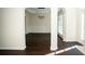 Open-concept dining room featuring dark floors, modern lighting, and stylish archways at 10770 Glenhurst Pass, Duluth, GA 30097