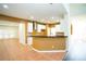 Stylish kitchen area with stainless steel vent hood and eat-in breakfast bar at 10770 Glenhurst Pass, Duluth, GA 30097