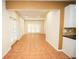 Open kitchen area with tile flooring and an open view to other rooms at 10770 Glenhurst Pass, Duluth, GA 30097