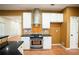 Modern kitchen with stainless steel appliances, mosaic backsplash, and granite countertops at 10770 Glenhurst Pass, Duluth, GA 30097