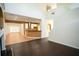 Open concept living area with tile flooring and view into modern kitchen at 10770 Glenhurst Pass, Duluth, GA 30097