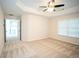 Bright main bedroom offers ample space with neutral carpet and a nearby walk-in closet at 10770 Glenhurst Pass, Duluth, GA 30097