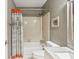 Bathroom featuring a tub with a shower, a toilet, and a vanity with a marble countertop at 1386 Sheffield Glen Ne Way, Atlanta, GA 30329