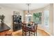 Cozy dining area with chandelier and natural light from windows at 1386 Sheffield Glen Ne Way, Atlanta, GA 30329