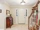 Bright foyer featuring neutral decor and staircase with wooden banister at 1386 Sheffield Glen Ne Way, Atlanta, GA 30329