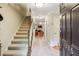 Inviting foyer with staircase and view into the living space at 1386 Sheffield Glen Ne Way, Atlanta, GA 30329