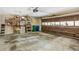 Spacious garage with brown door features storage shelves and is perfect for organization and parking at 1386 Sheffield Glen Ne Way, Atlanta, GA 30329