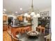 Open-concept kitchen and dining area with stainless steel appliances at 1386 Sheffield Glen Ne Way, Atlanta, GA 30329