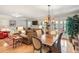 Open-concept living room with a dining area, natural light, and hardwood floors at 1386 Sheffield Glen Ne Way, Atlanta, GA 30329