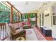 Inviting screened-in porch with outdoor seating and pleasant backyard views at 1386 Sheffield Glen Ne Way, Atlanta, GA 30329