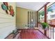Covered porch with comfortable seating and views of the surrounding neighborhood at 1386 Sheffield Glen Ne Way, Atlanta, GA 30329