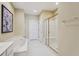 Bathroom features a soaking tub and glass enclosed shower at 25 Hampreston Court Ct, Johns Creek, GA 30022