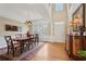 Elegant dining room with a chandelier, hardwood floors, and a large window at 25 Hampreston Court Ct, Johns Creek, GA 30022