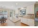 Charming kitchen with stainless steel appliances, a center island, and bright breakfast area with a backyard view at 25 Hampreston Court Ct, Johns Creek, GA 30022