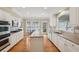 Charming kitchen with stainless steel appliances, a center island, and bright breakfast area with a backyard view at 25 Hampreston Court Ct, Johns Creek, GA 30022