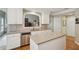 Spacious kitchen featuring stainless steel appliances, a center island, lots of countertop space and hardwood floors at 25 Hampreston Court Ct, Johns Creek, GA 30022