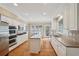 Charming kitchen with stainless steel appliances, a center island, and bright breakfast area with a backyard view at 25 Hampreston Court Ct, Johns Creek, GA 30022