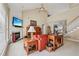 Cozy living room with a fireplace, comfortable seating, and lots of natural light at 25 Hampreston Court Ct, Johns Creek, GA 30022