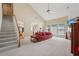Bright living room featuring a vaulted ceiling, fireplace, and comfortable seating at 25 Hampreston Court Ct, Johns Creek, GA 30022