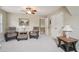 Cozy sitting area features comfortable chairs, an ottoman, and a window view at 25 Hampreston Court Ct, Johns Creek, GA 30022