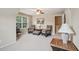 Cozy sitting area features comfortable chairs, an ottoman, and a window view at 25 Hampreston Court Ct, Johns Creek, GA 30022