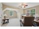 Bright sitting area with vaulted ceilings, comfortable chairs and natural light at 25 Hampreston Court Ct, Johns Creek, GA 30022