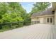 View of deck overlooking backyard with black railing and lush green trees at 2814 Tanner Lake Nw Trl, Marietta, GA 30064