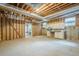 Unfinished basement featuring concrete flooring and exposed wooden beams and insulation at 2814 Tanner Lake Nw Trl, Marietta, GA 30064