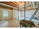 Unfinished basement featuring concrete flooring, a workbench and an outdoor view at 2814 Tanner Lake Nw Trl, Marietta, GA 30064