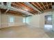 Unfinished basement with exposed ductwork, door to backyard, and painted walls at 2814 Tanner Lake Nw Trl, Marietta, GA 30064