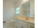 Bathroom offers natural light from window, vanity with drawers, and tile flooring at 2814 Tanner Lake Nw Trl, Marietta, GA 30064