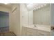 Bright white bathroom with long vanity and mirror at 2814 Tanner Lake Nw Trl, Marietta, GA 30064