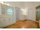 Bright bathroom boasts double vanities, wood floors, and natural light from the arched window at 2814 Tanner Lake Nw Trl, Marietta, GA 30064