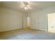 Bright bedroom features plush carpeting, neutral walls, and a ceiling fan with light fixture at 2814 Tanner Lake Nw Trl, Marietta, GA 30064