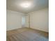 A carpeted bedroom with neutral walls and a view into the hallway at 2814 Tanner Lake Nw Trl, Marietta, GA 30064
