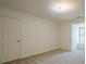 A bright bedroom with carpet and white walls, featuring a window seat at 2814 Tanner Lake Nw Trl, Marietta, GA 30064