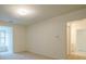 Carpeted bedroom with neutral walls and a view from the window seat at 2814 Tanner Lake Nw Trl, Marietta, GA 30064