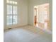 Bright bedroom with neutral carpet, white walls, and large windows at 2814 Tanner Lake Nw Trl, Marietta, GA 30064
