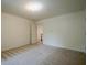 Carpeted bedroom with neutral walls and a view of the hallway and staircase at 2814 Tanner Lake Nw Trl, Marietta, GA 30064